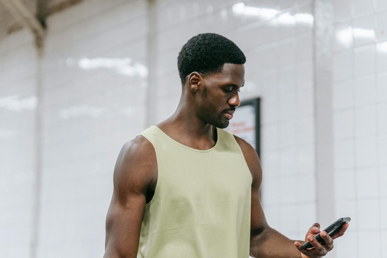 Close-up of a person using a smartphone, likely engaging with a financial application, symbolizing modern digital finance and connectivity.